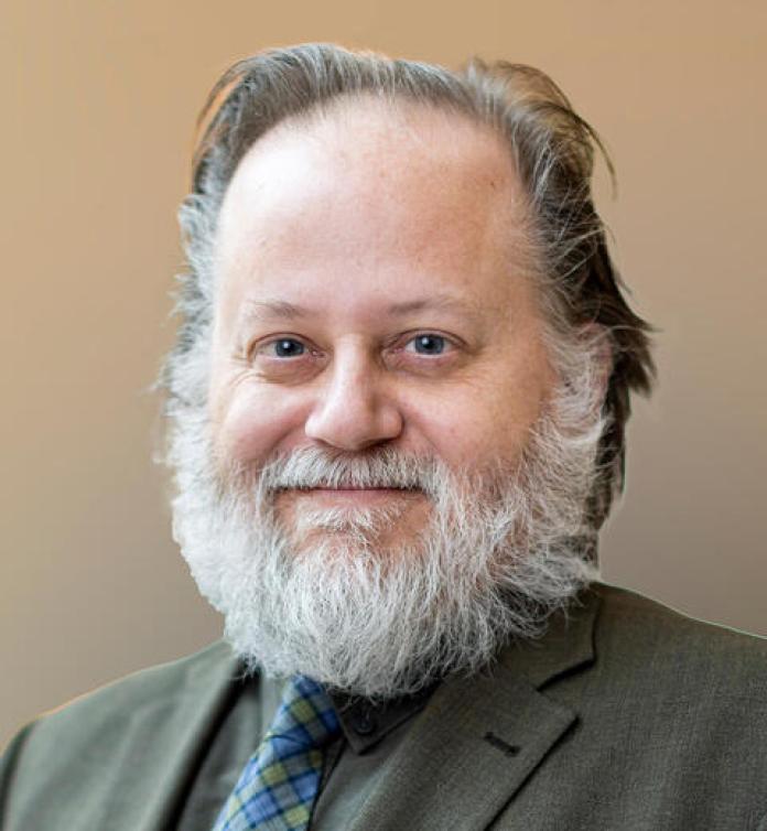 A photo of Charles Howe, PhD.
